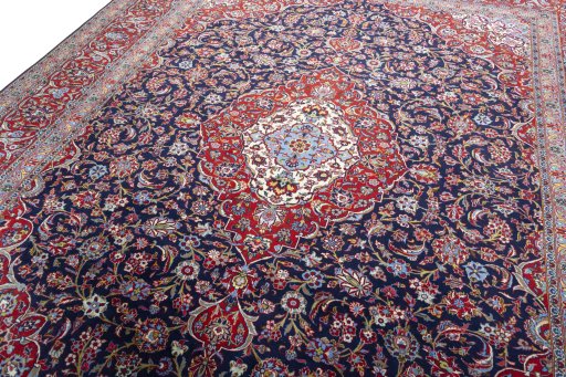 Backside of handmade New Kashan rug showing knot structure and weave density