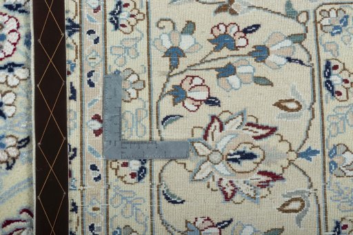 Backside of handmade 2000s Nain rug showing knot structure and weave density
