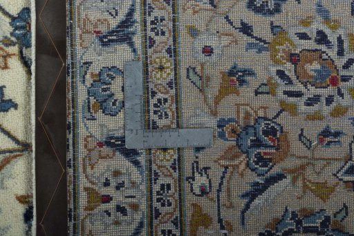 Backside of handmade 2000s Kashan rug showing knot structure and weave density