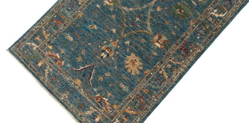 Backside of handmade New Farahan rug showing knot structure and weave density