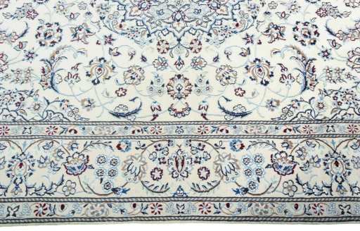 Corner detail of New Nain rug showing border pattern and Wool pile