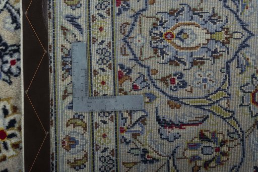 Backside of handmade 2000s Kashan rug showing knot structure and weave density