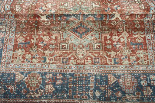 Corner detail of 1930s Heriz rug showing border pattern and Wool pile