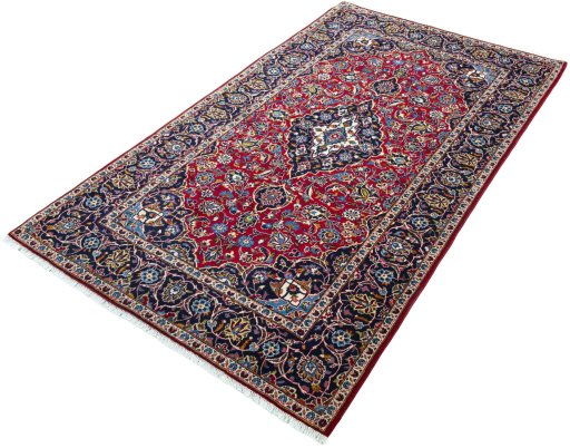 Corner detail of 2000s Kashan rug showing border pattern and Wool pile