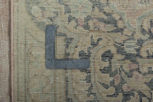 Backside of handmade 1950s Vintage rug showing knot structure and weave density