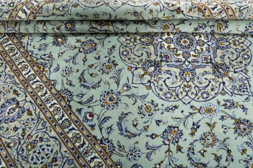 Close-up detail of 2000s Kashan rug from Iran / Persia showing Wool weave