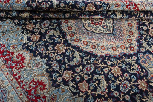 Close-up detail of 1970s Kashmar rug from Iran / Persia showing Wool weave
