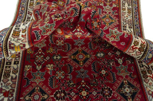 Corner detail of 2000s Shiraz rug showing border pattern and Wool pile