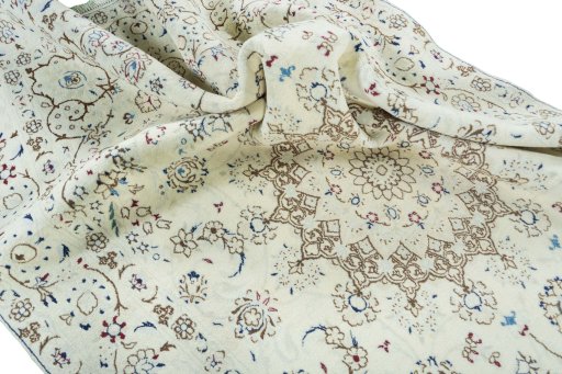Surface texture of 2000s Nain rug with natural Wool and intricate pattern