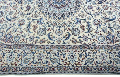 Corner detail of 2000s Nain rug showing border pattern and Wool pile