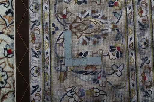 Backside of handmade 2000s Kashan rug showing knot structure and weave density