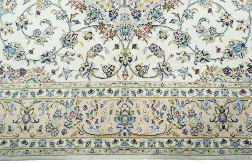 Corner detail of New Kashan rug showing border pattern and Wool pile