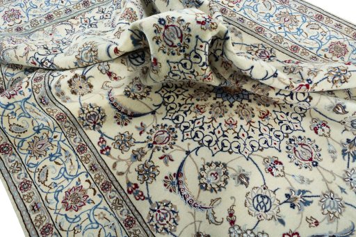 Surface texture of 2000s Nain rug with natural Wool and intricate pattern