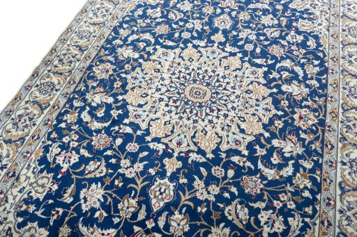 Backside of handmade 2000s Nain rug showing knot structure and weave density