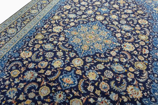 Backside of handmade 2000s Kashan rug showing knot structure and weave density