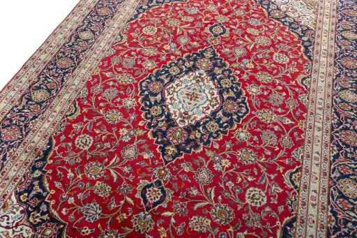 Backside of handmade 2000s Kashan rug showing knot structure and weave density