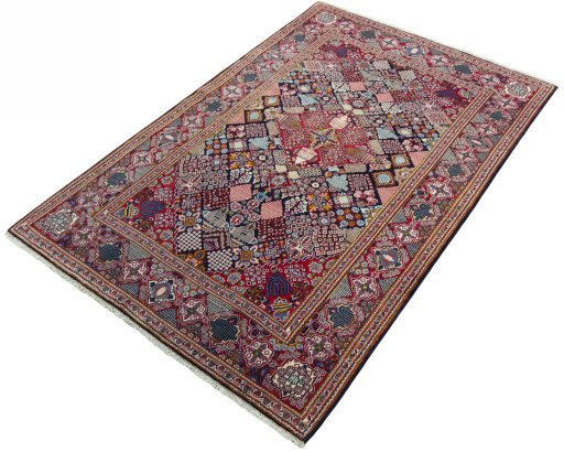 Corner detail of 2000s Kashan rug showing border pattern and Wool pile