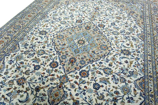 Backside of handmade 2000s Kashan rug showing knot structure and weave density