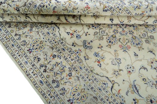 Close-up detail of 2000s Kashan rug from Iran / Persia showing Wool weave