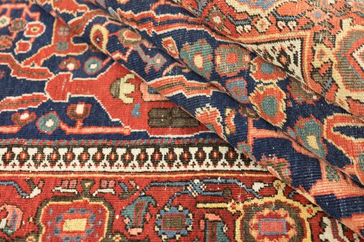 Close-up detail of 1900s Farahan rug from Iran / Persia showing Wool weave