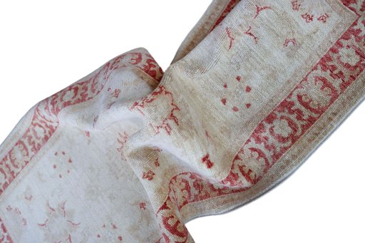 Backside of handmade New Farahan rug showing knot structure and weave density