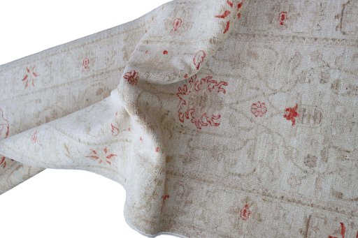 Backside of handmade New Farahan rug showing knot structure and weave density