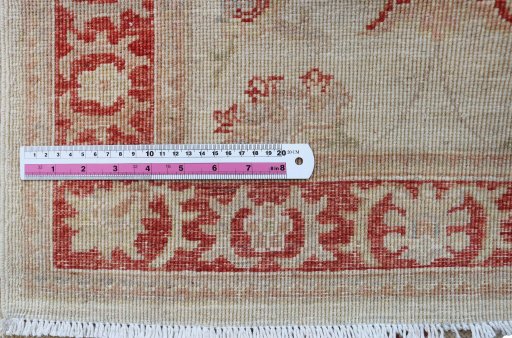 Backside of handmade New Farahan rug showing knot structure and weave density