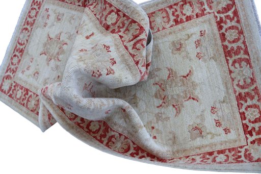Backside of handmade New Farahan rug showing knot structure and weave density