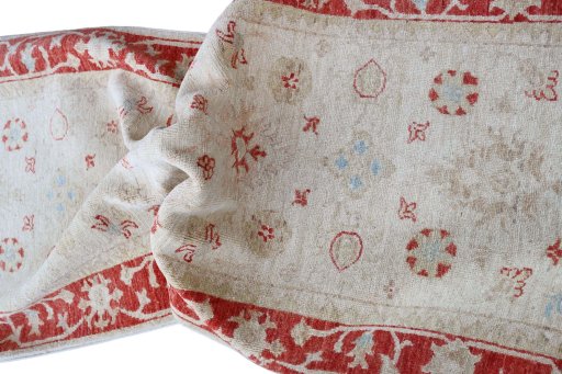 Backside of handmade New Farahan rug showing knot structure and weave density