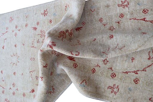 Backside of handmade New Farahan rug showing knot structure and weave density