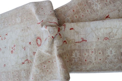 Backside of handmade New Farahan rug showing knot structure and weave density