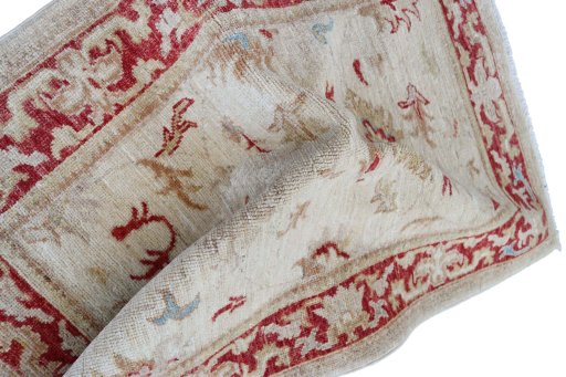 Backside of handmade New Farahan rug showing knot structure and weave density