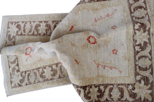 Backside of handmade New Farahan rug showing knot structure and weave density