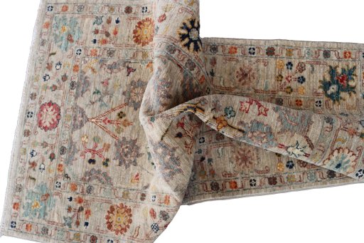 Backside of handmade New Farahan rug showing knot structure and weave density