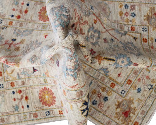 Backside of handmade New Farahan rug showing knot structure and weave density