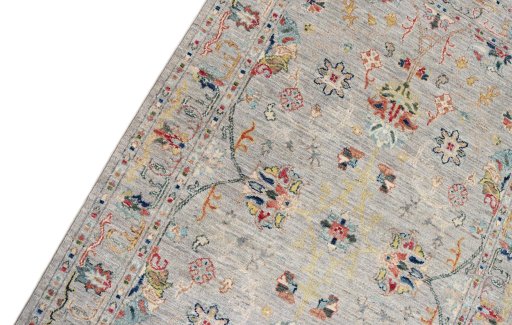 Backside of handmade New Farahan rug showing knot structure and weave density