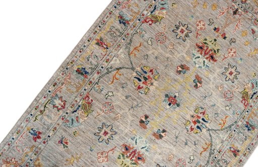 Backside of handmade New Farahan rug showing knot structure and weave density