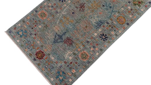 Backside of handmade New Farahan rug showing knot structure and weave density