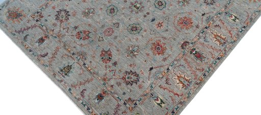 Backside of handmade New Farahan rug showing knot structure and weave density