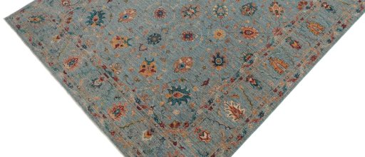 Backside of handmade New Farahan rug showing knot structure and weave density