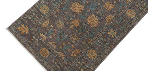 Backside of handmade New Farahan rug showing knot structure and weave density