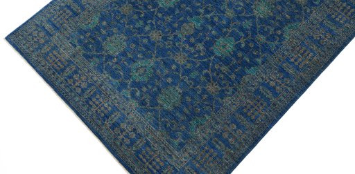 Backside of handmade New Farahan rug showing knot structure and weave density