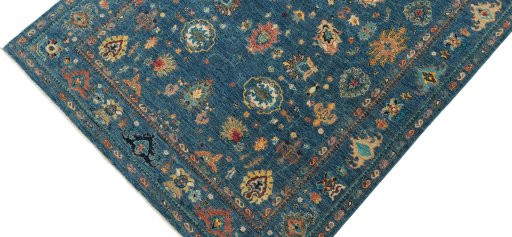 Backside of handmade New Farahan rug showing knot structure and weave density