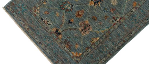 Backside of handmade New Farahan rug showing knot structure and weave density