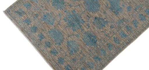 Backside of handmade New Farahan rug showing knot structure and weave density