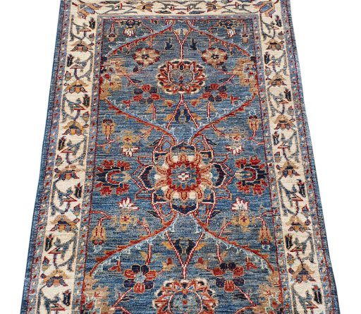 Backside of handmade New Farahan rug showing knot structure and weave density