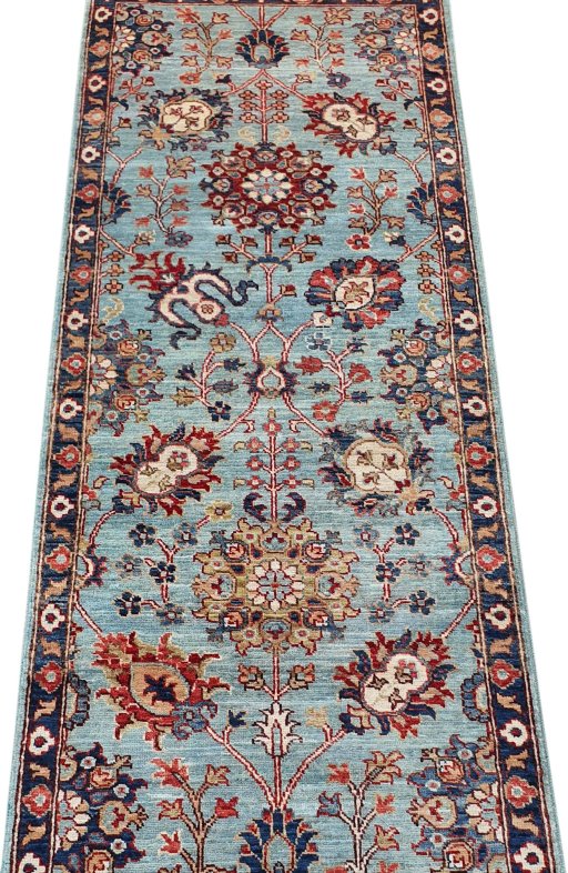 Backside of handmade New Farahan rug showing knot structure and weave density