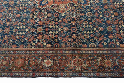 Corner detail of 1930s Farahan rug showing border pattern and Wool pile