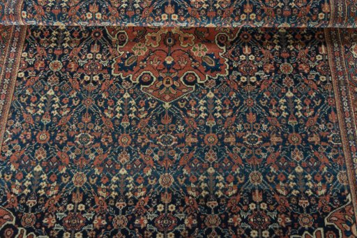 Close-up detail of 1930s Farahan rug from Iran / Persia showing Wool weave