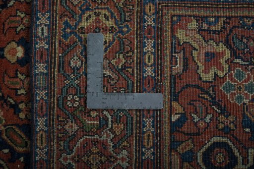 Backside of handmade 1930s Farahan rug showing knot structure and weave density